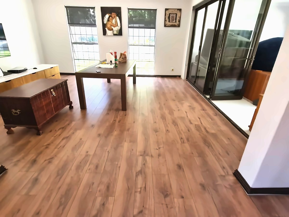 A home office with a wood-look plank floor